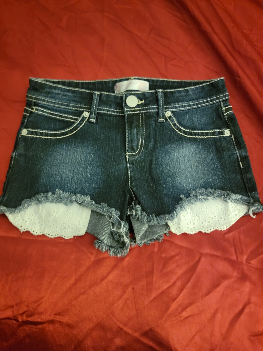 No Boundaries Dark Blue Denim Cutoff Shorts with White Eyelet Trim